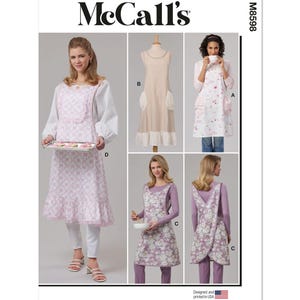 May include: McCall's sewing pattern M5898 featuring aprons in various styles. The aprons include designs with floral patterns, lace trim, and a classic bib apron. The image shows different apron styles, including a cross-back design.
