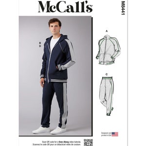 May include: A sewing pattern for a hooded sweatshirt and sweatpants set. The pattern includes instructions for a navy blue sweatshirt with grey sleeves and a matching pair of sweatpants with a grey stripe down the side. The pattern is designed and printed in the USA.