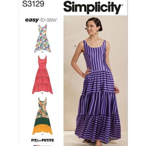 May include: Simplicity sewing pattern S3129 for dresses. The pattern includes a woman wearing a purple and white striped maxi dress. The pattern also shows three dress variations with floral and striped designs. The text "easy-to-sew" is visible.