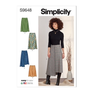 May include: Simplicity sewing pattern S9648 for a skirt with three different styles: a solid green skirt, a floral print skirt, and a plaid skirt with a contrasting fabric panel. The pattern includes instructions for making the skirt.