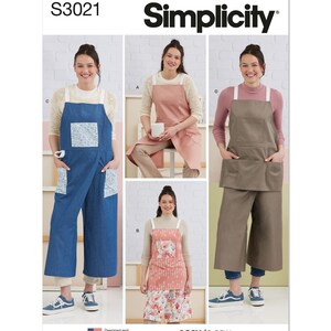 May include: Simplicity sewing pattern S3021 featuring aprons. The image shows different apron styles in various colors, including denim blue, pink, and brown. The aprons have pockets and straps. The text "easy-to-sew" is also visible.