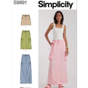 May include: Simplicity sewing pattern S9891 for a long skirt with pockets. The pattern includes three variations: a short skirt with a plaid pattern, a knee-length skirt with a green solid color, and a long skirt with a light blue solid color. The pattern is designed and printed in the USA.