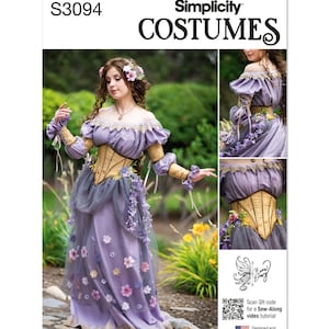 May include: A Simplicity Costumes sewing pattern for a purple and gold fairy costume. The pattern includes a corset, skirt, and sleeves. The model is wearing the costume and has a flower crown in her hair. The pattern includes a QR code for a sew-along video tutorial.