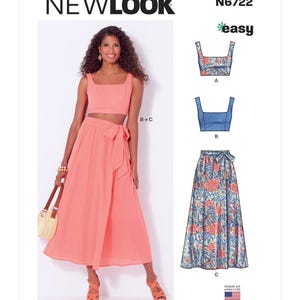 May include: A New Look sewing pattern, N6722, featuring a crop top and skirt. The model wears a coral-colored crop top and skirt. The pattern also includes a floral print crop top and skirt. The pattern is designed and printed in the USA.
