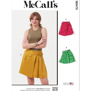 May include: McCall's sewing pattern M8479 for a skirt with three different styles: a red wrap skirt, a green pleated skirt with a pocket, and a yellow pleated skirt with a pocket and a belt.