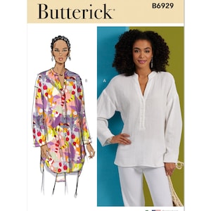 May include: Butterick B6929 sewing pattern featuring two long-sleeve tunic tops. One tunic is white, the other is a colorful print with red, purple, yellow, and green. The pattern includes a US flag and text that says "Designed and printed in USA."