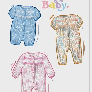 May include: Simplicity Baby pattern S3242 features three baby romper designs. One is light blue with white floral print, another is patterned with woodland animals, and the third is pink with a floral design. The pattern is designed and printed in the USA.