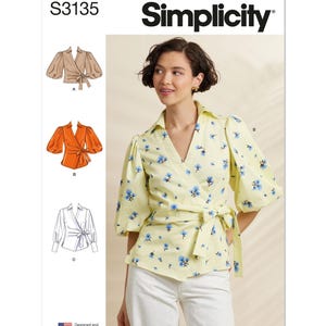 May include: Simplicity pattern S3135 features a wrap top with short, puffed sleeves and a tie closure. The top is yellow with blue floral print. The image also shows illustrations of the wrap top in different colors and styles. Designed and printed in USA.