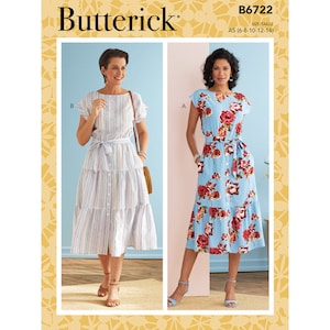 May include: A sewing pattern for a midi dress with two different styles. The dress on the left is striped and the dress on the right has a floral print. The pattern is for sizes 6-14.