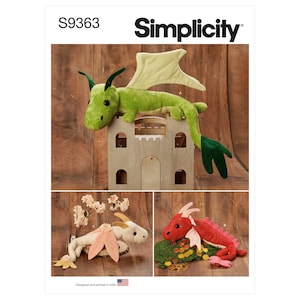 May include: A sewing pattern for making three plush dragon toys. The pattern is called Simplicity S9363. The dragons are green, pink, and red. The green dragon is perched on a wooden castle. The pink dragon is lying on a bed of moss and gold coins. The red dragon is lying on a bed of moss and gold coins.