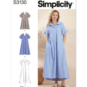 May include: Simplicity sewing pattern S3130 featuring three dress designs. The main image shows a woman wearing a blue and white striped dress. The pattern includes short-sleeved dresses with a collared neckline. The text "Designed and printed in USA" is visible.