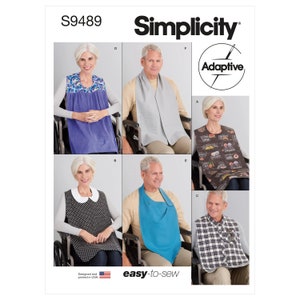 May include: Simplicity pattern S9489 featuring adaptive clothing designs. The image showcases various bibs and garments, including a blue bib, a gray scarf-like bib, and a patterned bib with food-related graphics. The designs are easy-to-sew and designed in the USA.