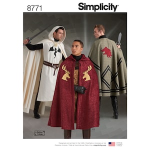 May include: Simplicity sewing pattern number 8771 for three hooded cloaks with different embroidered designs. The cloaks are in white, red, and green with black trim. The designs include a dragon, a stag, and a wolf.