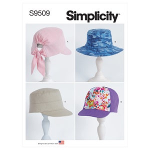 May include: Simplicity sewing pattern S9509 for four different hat styles. The pattern includes a pink hat with a bow, a blue camouflage hat, a beige hat with a visor, and a purple hat with a floral print.