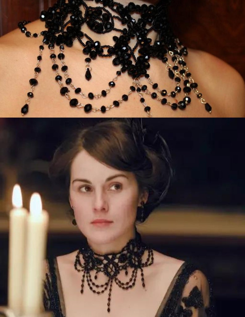 May include: A black beaded choker necklace with a delicate lace design and dangling strands of beads. The necklace is worn by a woman with dark hair and a black dress.