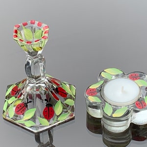 Set of 2 candle holders with ladybugs.