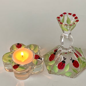 Set of 2 candle holders with ladybugs.