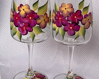 Set of two wine glasses with bright flowers, great for housewarming, wedding gift, birthdays, Valentine’s Day gift. They are for white wine.