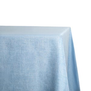 May include: A light blue tablecloth with a textured woven pattern. The tablecloth is made of a soft, durable fabric and is perfect for any occasion.