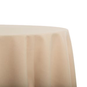 May include: A beige round tablecloth with a smooth, wrinkle-free surface. The tablecloth is draped over a table, creating a soft, elegant look.