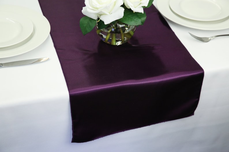 Purple-themed wedding reception supplies - plum satin table runner