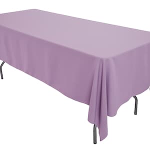 May include: A lavender tablecloth draped over a table with silver legs. The tablecloth is smooth and wrinkle-free.