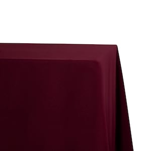 May include: A solid burgundy tablecloth, perfect for adding a touch of elegance to any event.