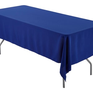 May include: A royal blue rectangular tablecloth draped over a table with silver legs. The tablecloth is made of a smooth, wrinkle-resistant fabric.