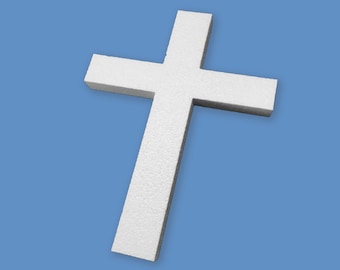 May include: A white foam cross, a religious symbol, against a blue background.