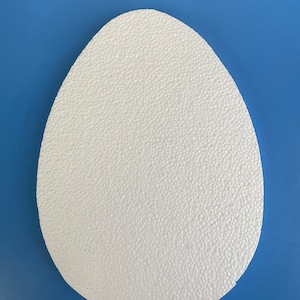 May include: A white foam egg shape, perfect for crafting and decorating.