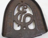 Antique Cast Iron Sad Iron Rest Made by Enterprise Manufacturing Company in Philadelphia, PA. Very Fine Condition with Some Rust