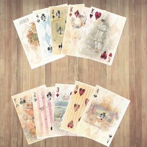 May include: A collection of ten playing cards arranged in two rows, featuring vintage-style illustrations of jesters, a carriage, and various suit symbols including hearts, diamonds, clubs, and spades, all set against a light, aged paper background.