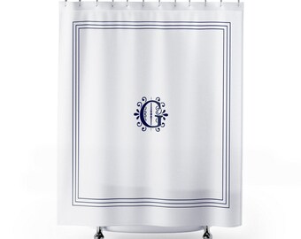 May include: White shower curtain with a navy blue border and a navy blue monogram of the letter "G" in a decorative font.