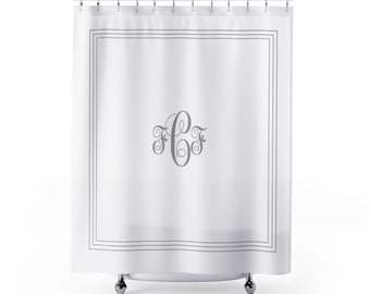 May include: White shower curtain with a gray double border and a gray monogram of the letters "C F" in a decorative font.