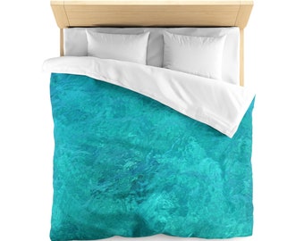 May include: A turquoise blue duvet cover with a water-like pattern. The duvet cover is 88 by 88 inches and is queen size. It is made of microfiber and has a white or cream reverse side.