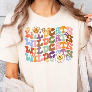 Women&#39;s Wildcats Shirt, Groovy Floral Family Game Day Shirts, Teacher T-Shirt, Team Mascot Shirt, School Spirit Shirt, Wildcats Baby Outfit