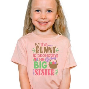 The Bunny Is Promoting Me To Big Sister Shirts for Girls | Easter Pregnancy Announcement T-Shirt for Kids | Fun Spring Baby Reveal Tee
