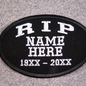 May include: Black oval patch with white embroidered text that reads "RIP NAME HERE 19XX - 20XX".