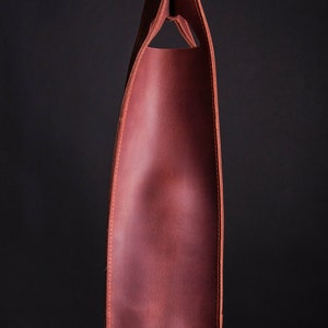 Side view of structured leather wine bottle bag with clean stitching, elegant romantic wine gift for anniversary celebration
