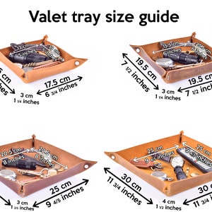 May include: Four brown leather valet trays of different sizes. The trays are shown with various items, such as keys, a flashlight, a watch, and a remote control. The dimensions of each tray are labeled in both inches and centimeters.
