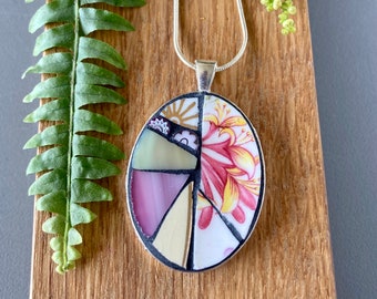 Floral China Mosaic Pendant in Pinks, Yellows and White. Delicate China and Millefiori Set in Oval Silver Plated Bezel.