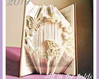 Butterfly frame combination cut and fold pattern