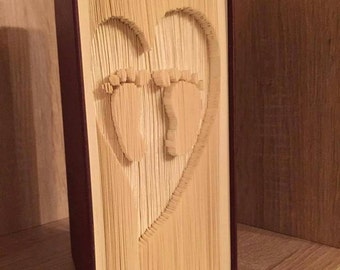 Baby feet in a heart cut and fold bookfolding pattern