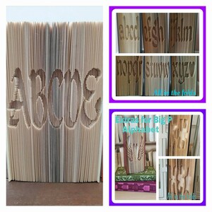 Peut inclure: Un livre dont les pages sont sculptées pour épeler "ABCs". Les lettres sont découpées dans les pages, créant un effet 3D unique. D'autres images montrent des lettres et des motifs sculptés.