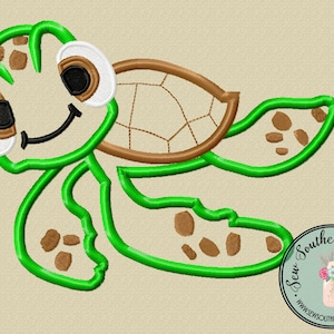 May include: Green and brown embroidered design of a cartoon turtle with large eyes and a smile. The turtle is swimming with its flippers outstretched.