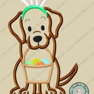 May include: Embroidered design of a brown dog wearing bunny ears and a green headband, holding a basket with colourful Easter eggs.