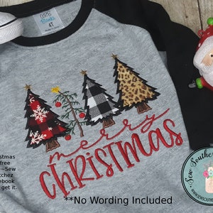 May include: A gray and black raglan t-shirt with three embroidered Christmas trees. The trees are decorated with plaid, buffalo check, and leopard print fabric. The text "Merry Christmas" is embroidered in red below the trees. The text "No Wording Included" is printed in black below the embroidery.