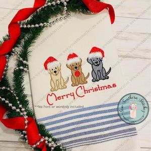 May include: Embroidered design of three dogs wearing Santa hats with the text "Merry Christmas". The design is on a white kitchen towel with blue and white stripes.