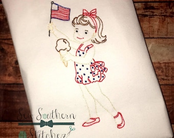 May include: Embroidered design of a girl holding an ice cream cone and an American flag. The girl is wearing a red, white, and blue polka dot dress and a red bow in her hair. The design is stitched in red, white, blue, and gold thread. "Sew Southern Stitchez" is embroidered below the design.