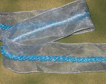 this is a 2 yards 1" width high ended with light icy blue organza trim with light blue color bead trim for your fashion design decorative.b1